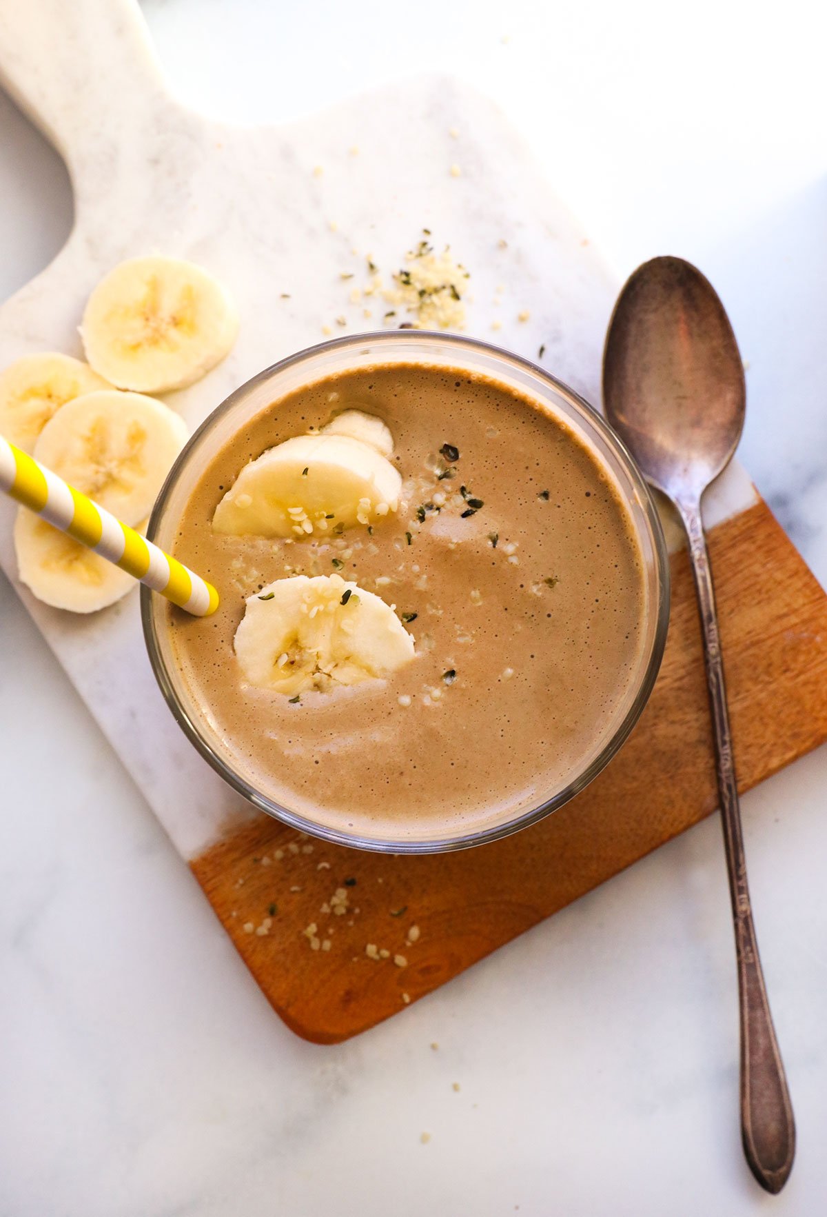 chocolate protein smoothie topped with banana slices. 