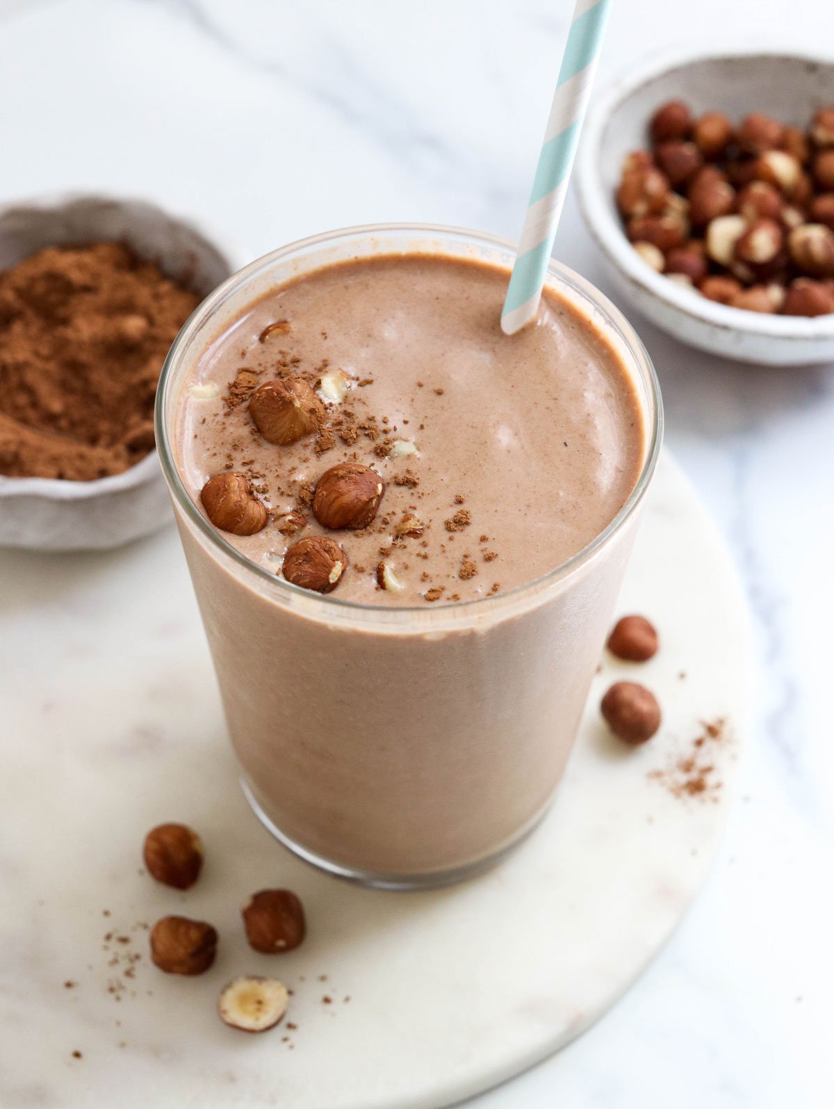 chocolate hazelnut smoothie in glass with straw