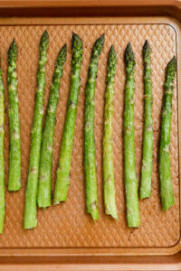 roasted asparagus on pan.
