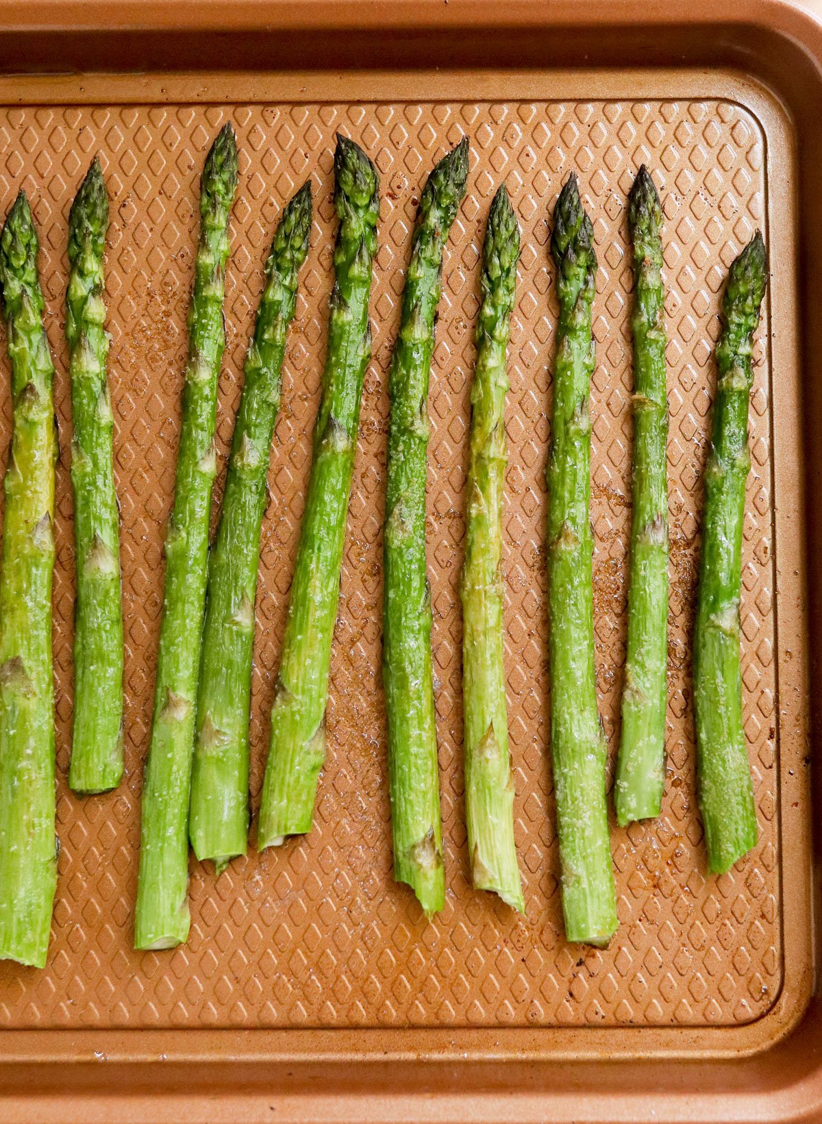 roasted asparagus on pan.