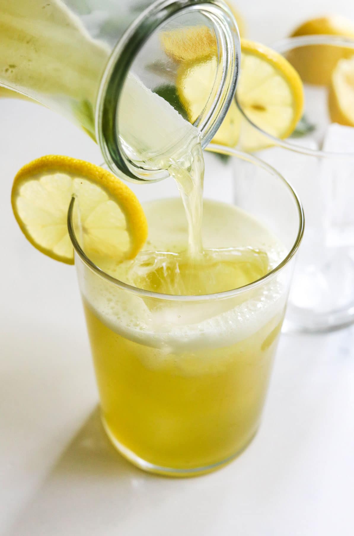 basil lemonade poured into glass