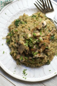 mushroom spinach quinoa risotto on plate with forks