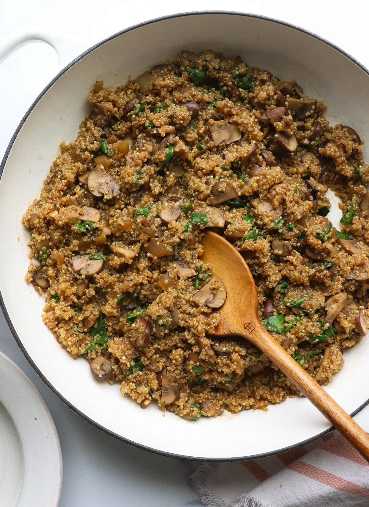 Mushroom Quinoto in white frying pan.