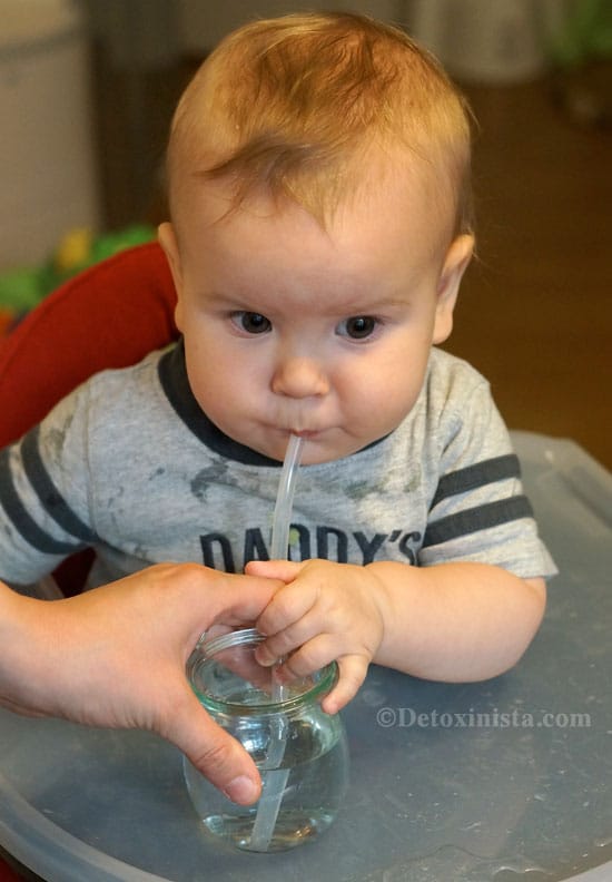 baby drinking from a straw