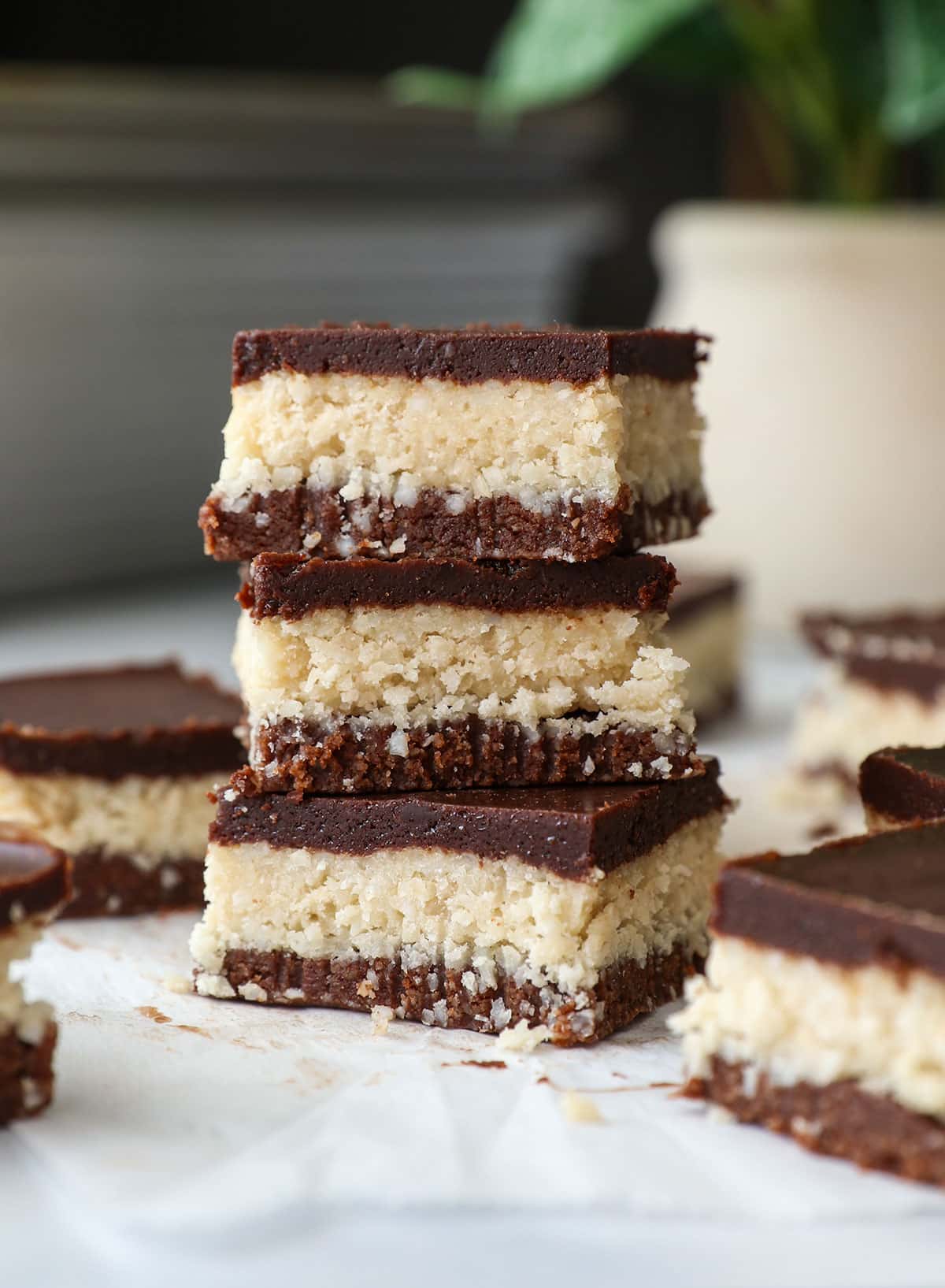 coconut chocolate bars stacked to show each layer.