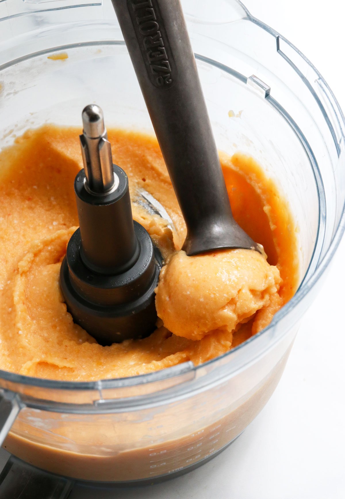 peach ice cream served from food processor