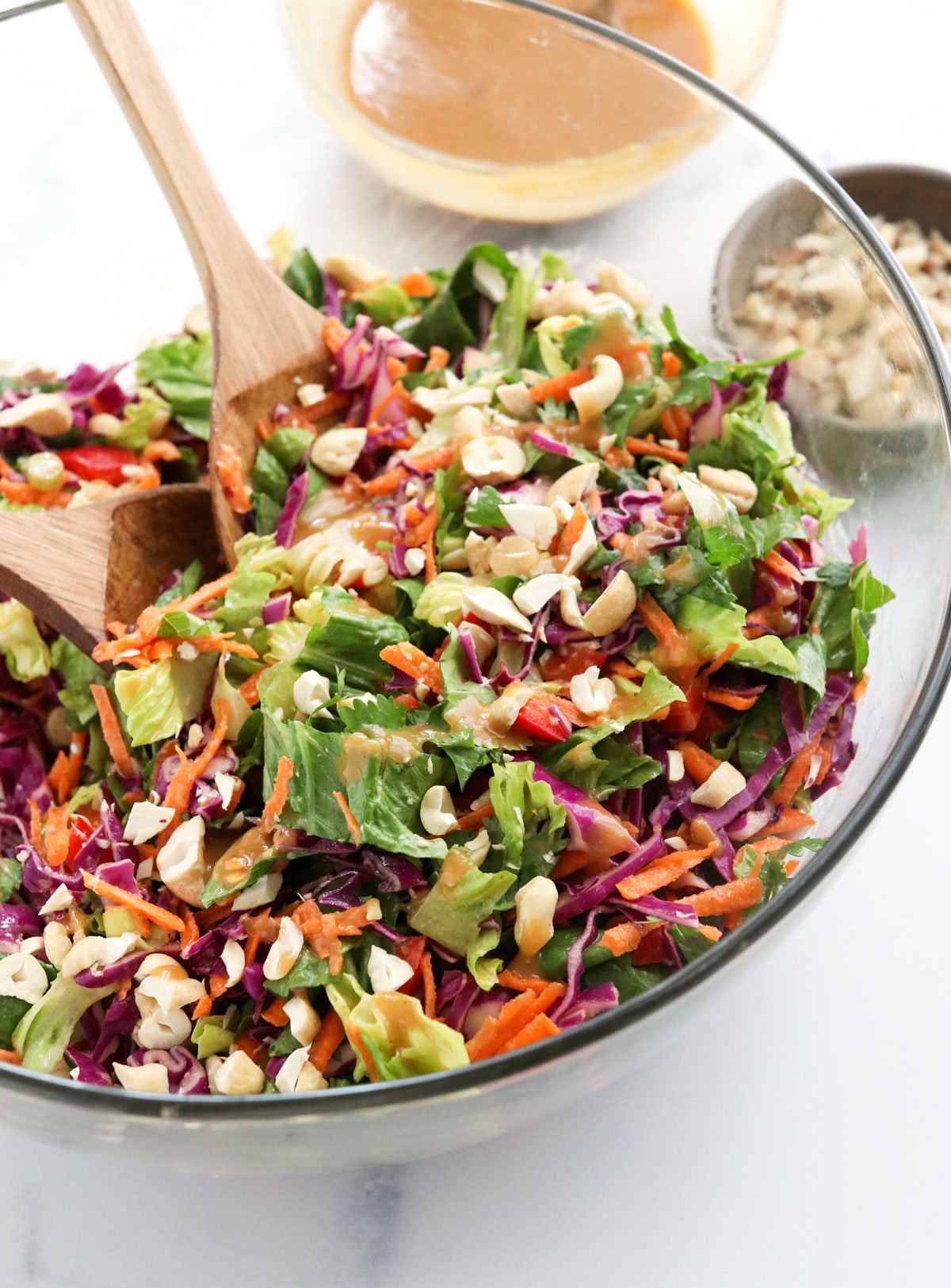 thai salad with peanut dressing in glass bowl
