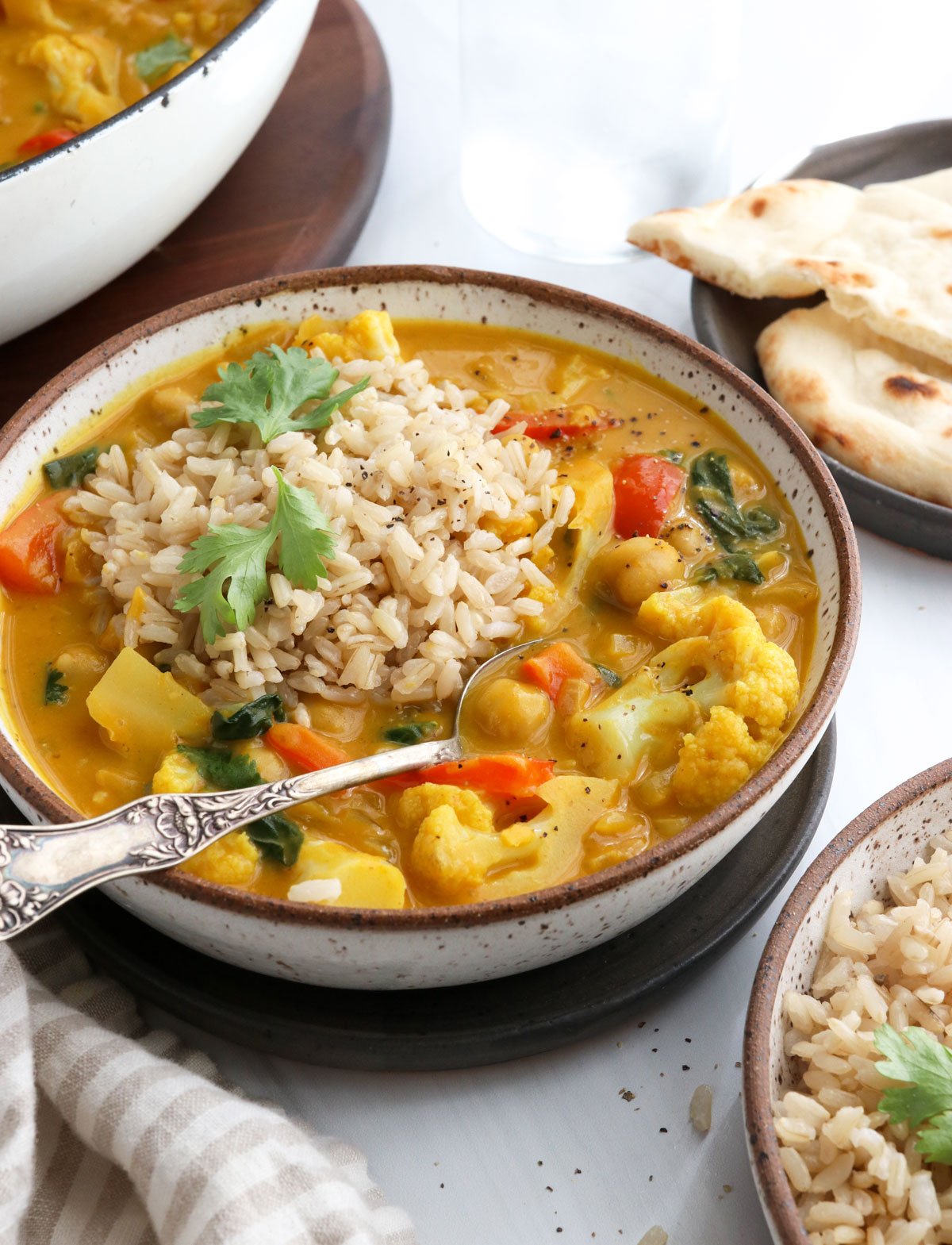 pumpkin curry served with rice and a spoon