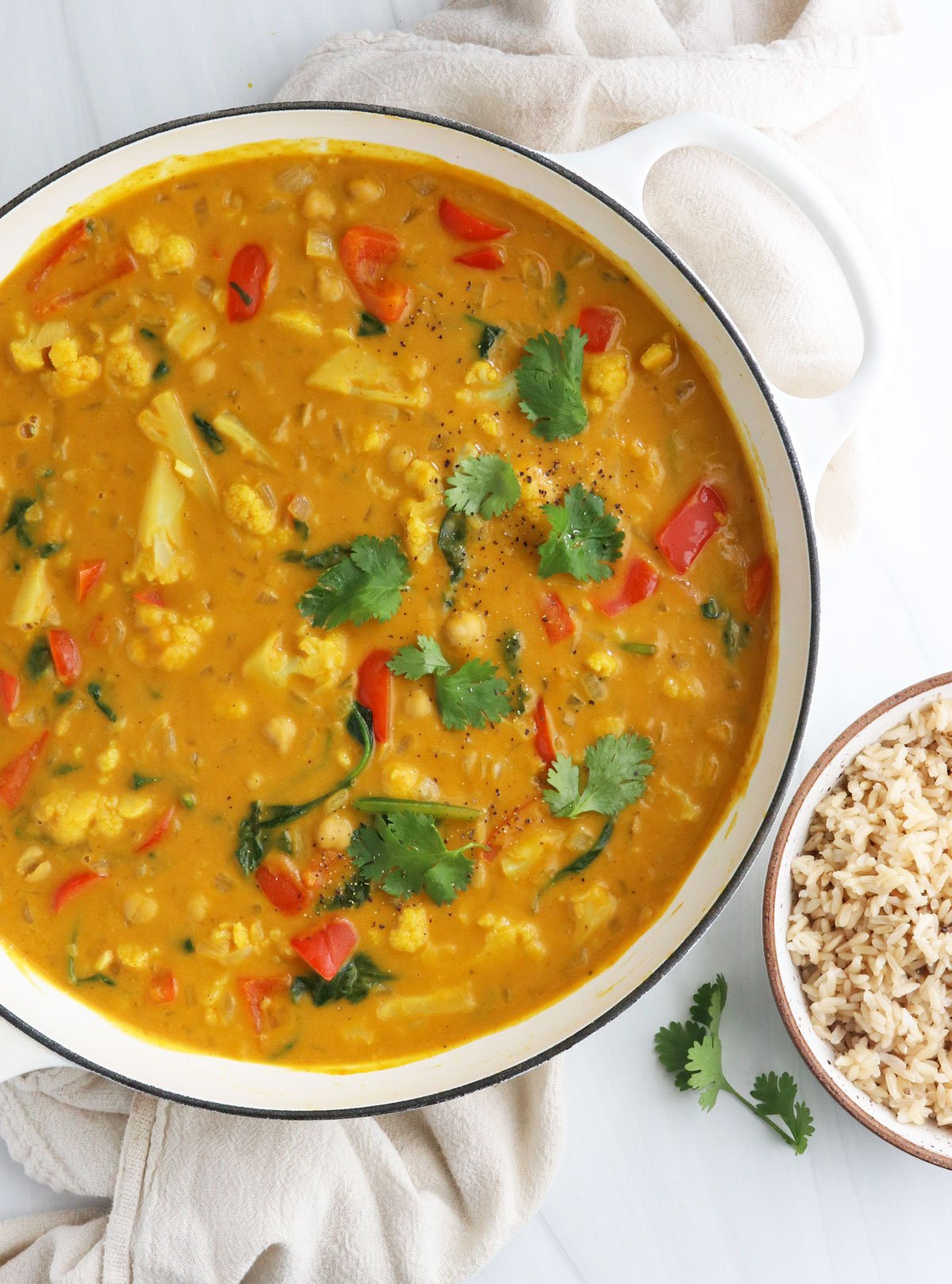 pumpkin curry in white skillet