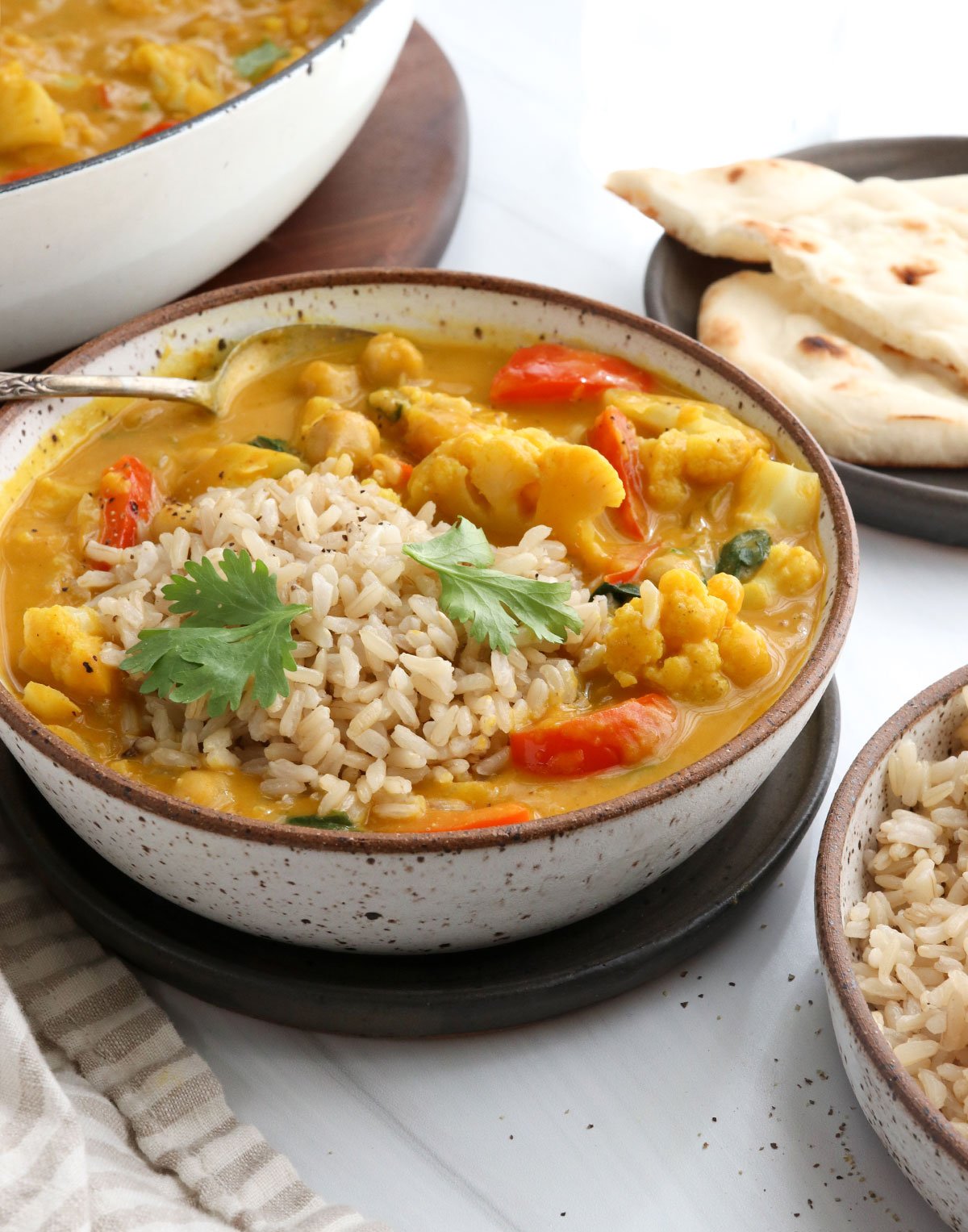 pumpkin curry bowl topped with rice and cilantro