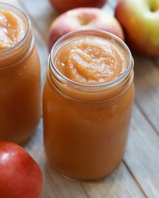 slow cooker applesauce in a glass jar