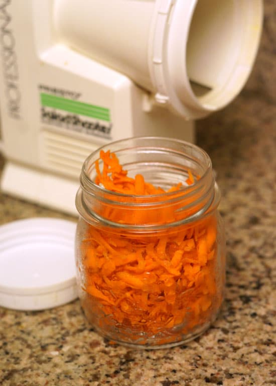 shredded carrots in a small glass