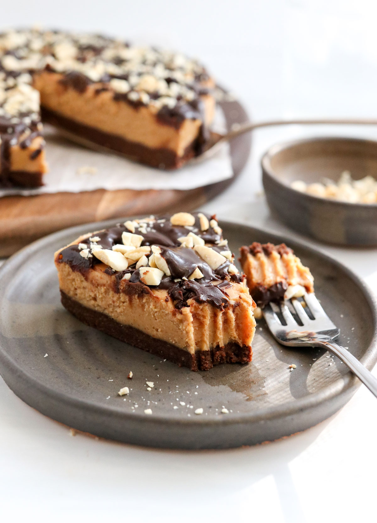 peanut butter pie slice on plate with forkful removed