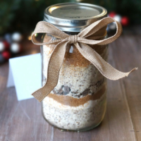 Cookie dry good ingredients in a mason jar with bow
