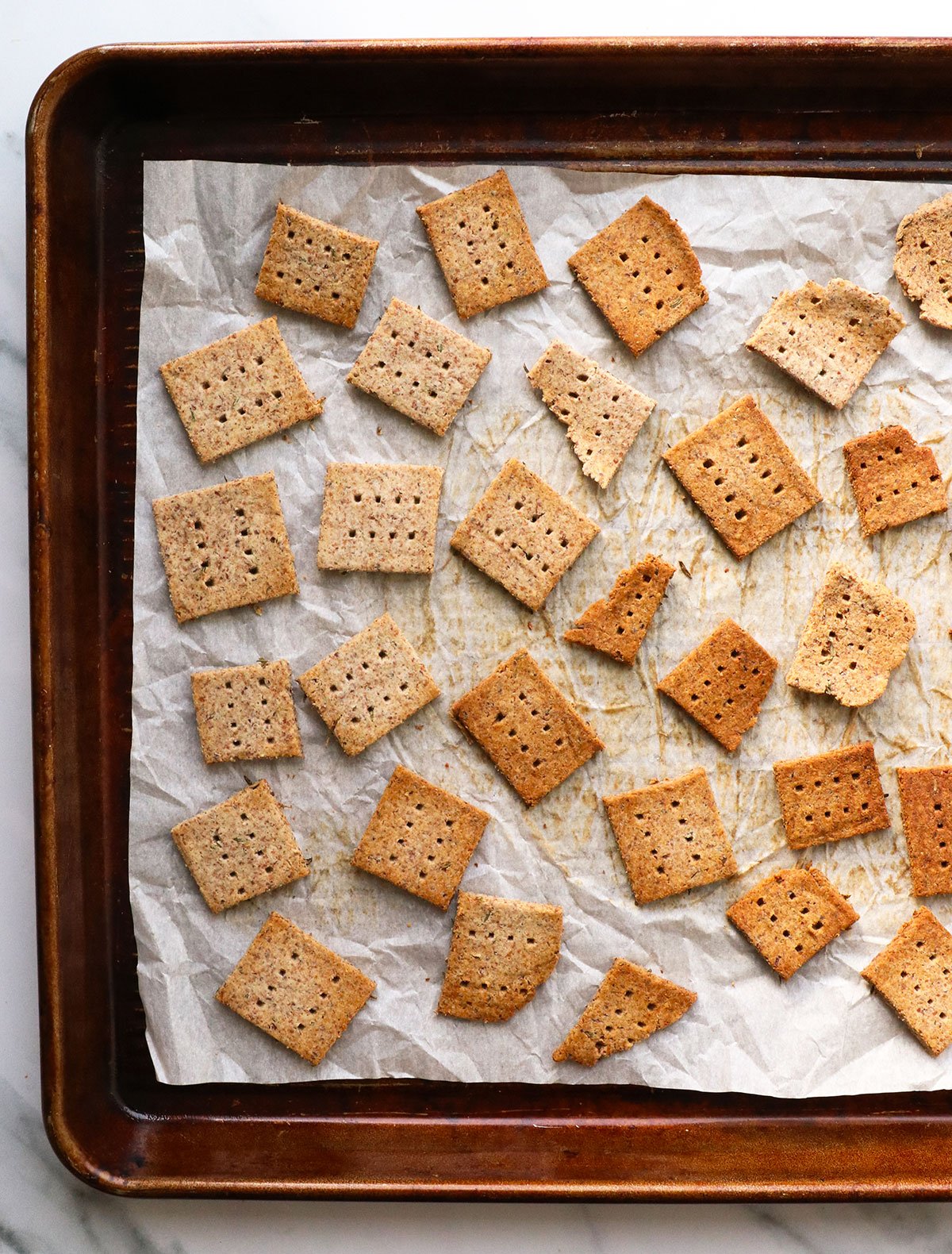 baked almond crackers on a baking sheet.