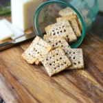 Easy almond pulp crackers coming out of glass