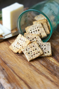 Easy almond pulp crackers coming out of glass