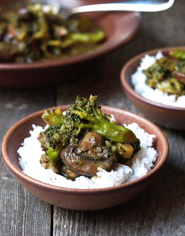 beef and broccoli in a bowl with rice