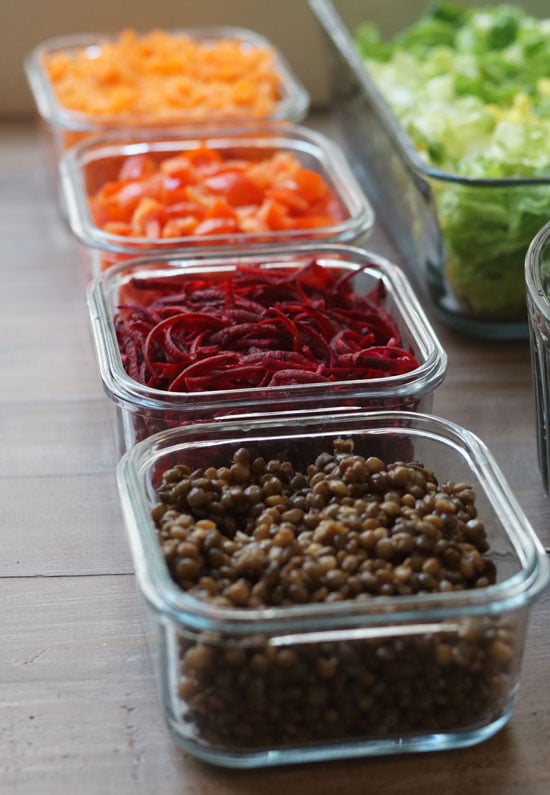 salad toppings in small glass containers