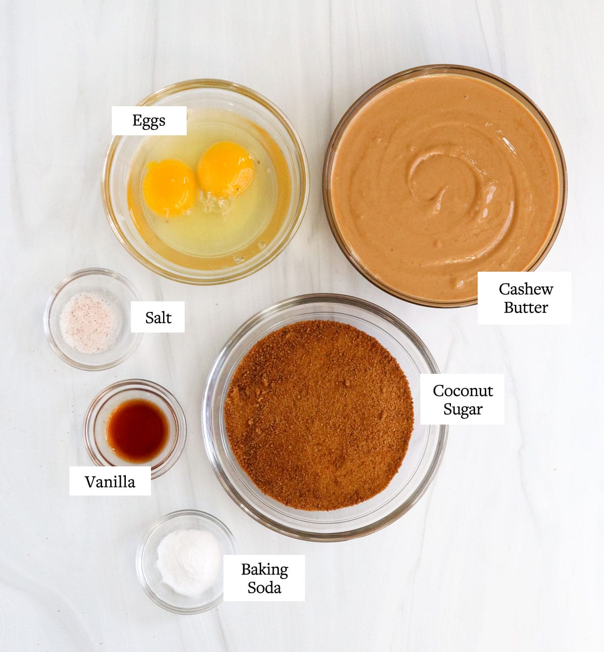 cashew butter cookie ingredients in glass bowls