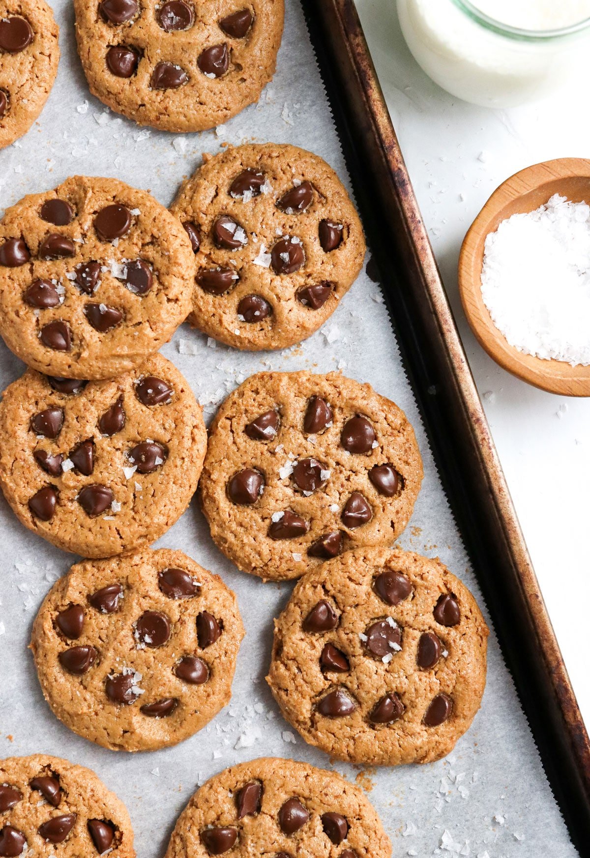 cashew butter cookies on pan with chocolate chips