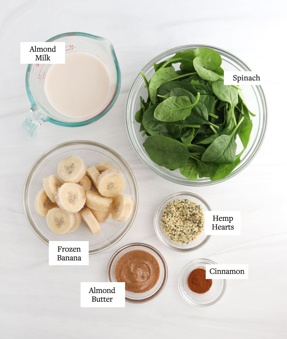 spinach smoothie ingredients in glass bowls