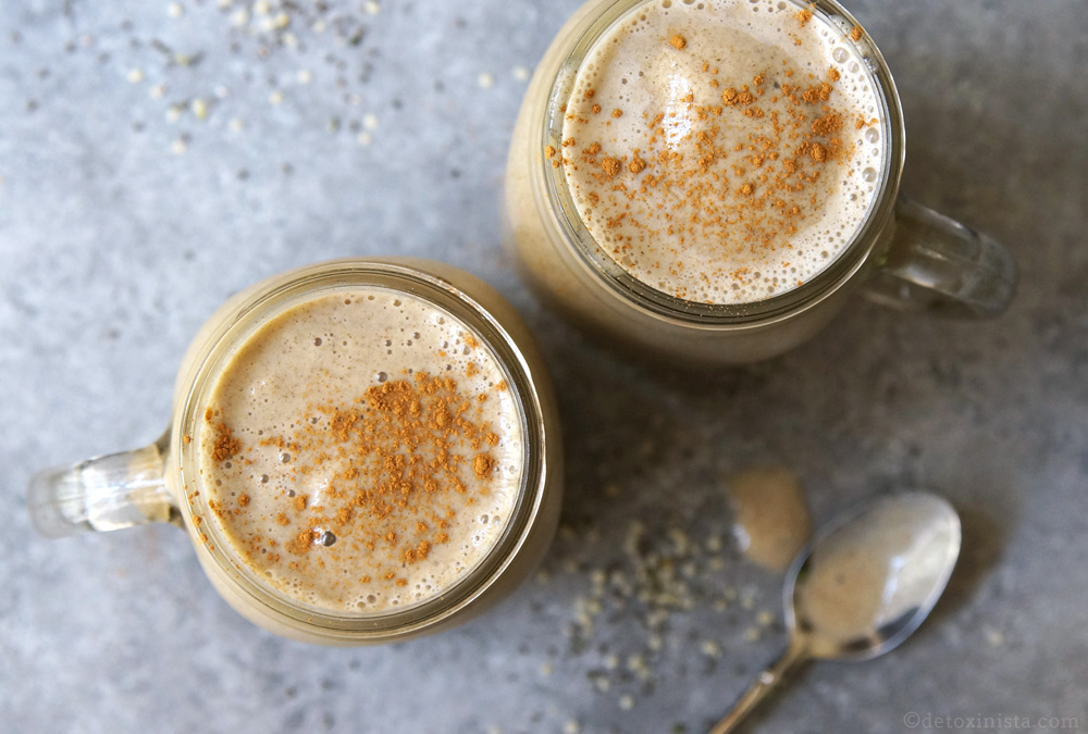 two glass mugs filled with frozen chai latte