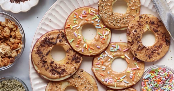 toppings added to apple donut slices.