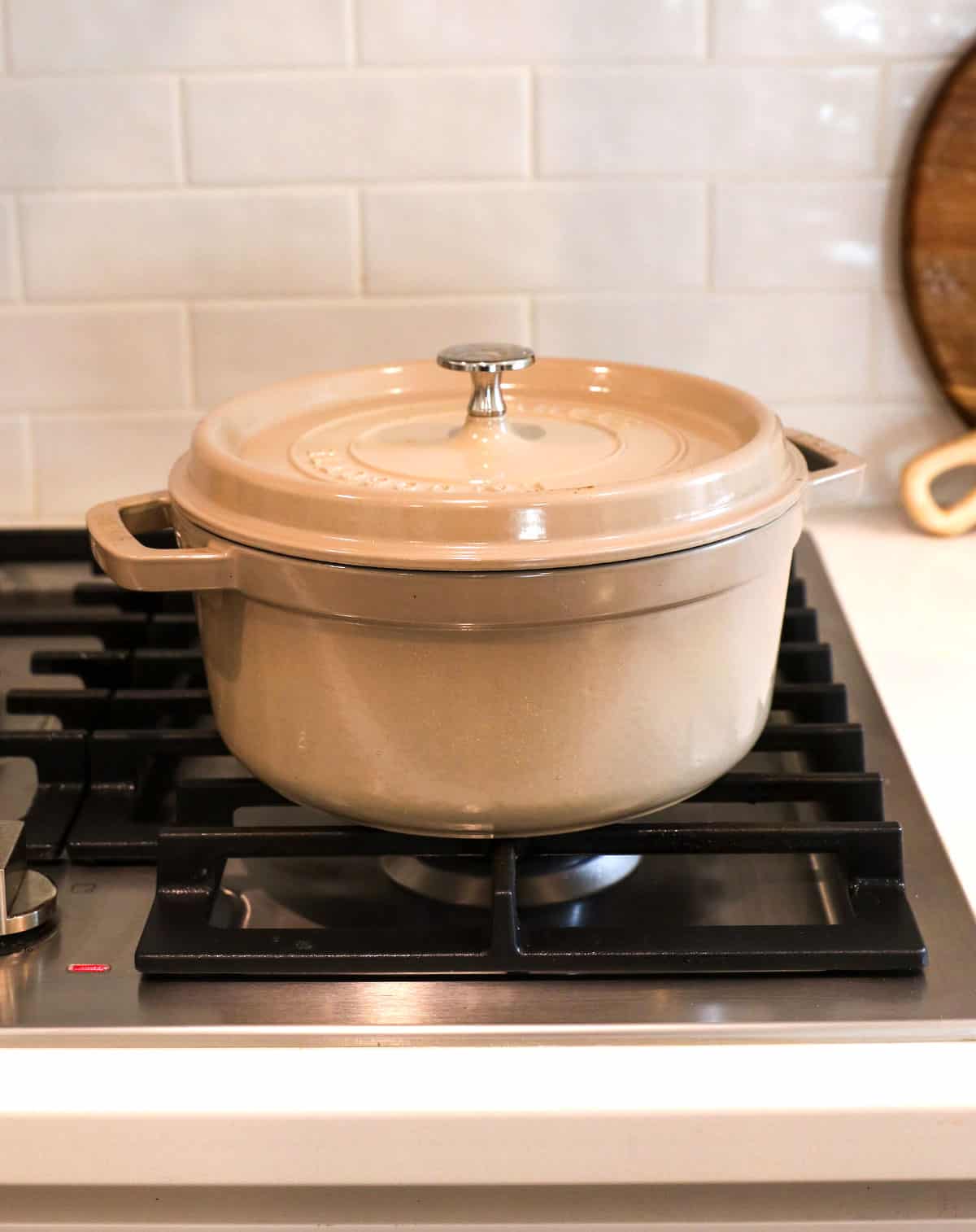 dutch oven with a lid on the stove top.