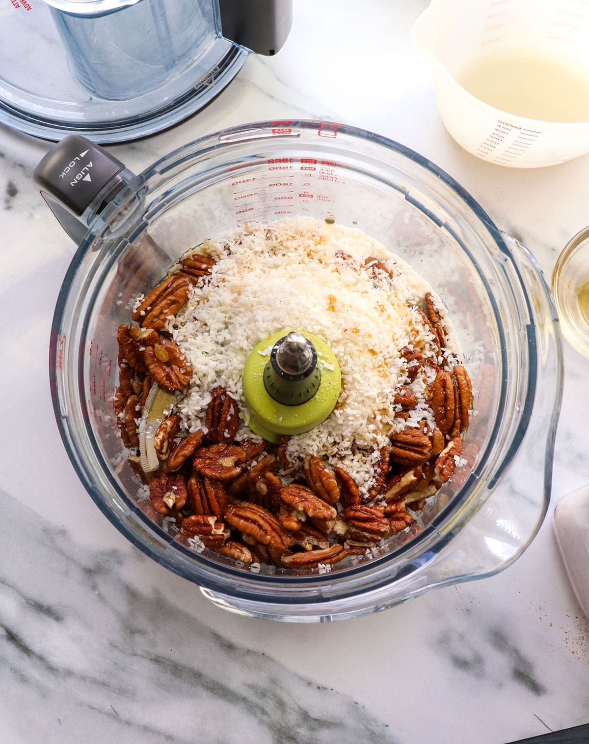 pecans, coconut, and salt in a food processor.