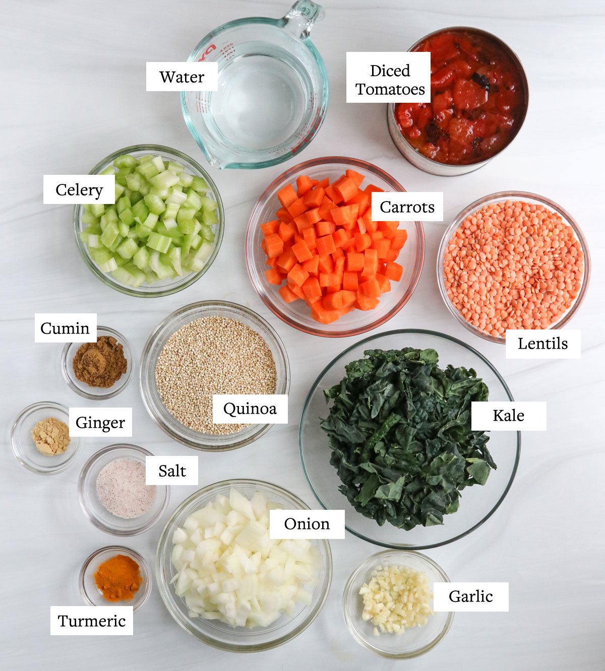 quinoa soup ingredients overhead in glass bowls.