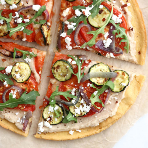socca pizza with vegetables on top