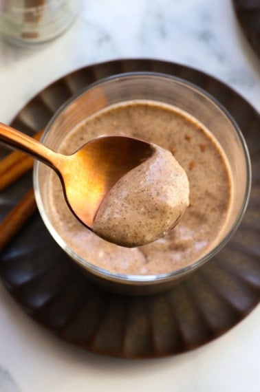 chai chia pudding served on a gold spoon.