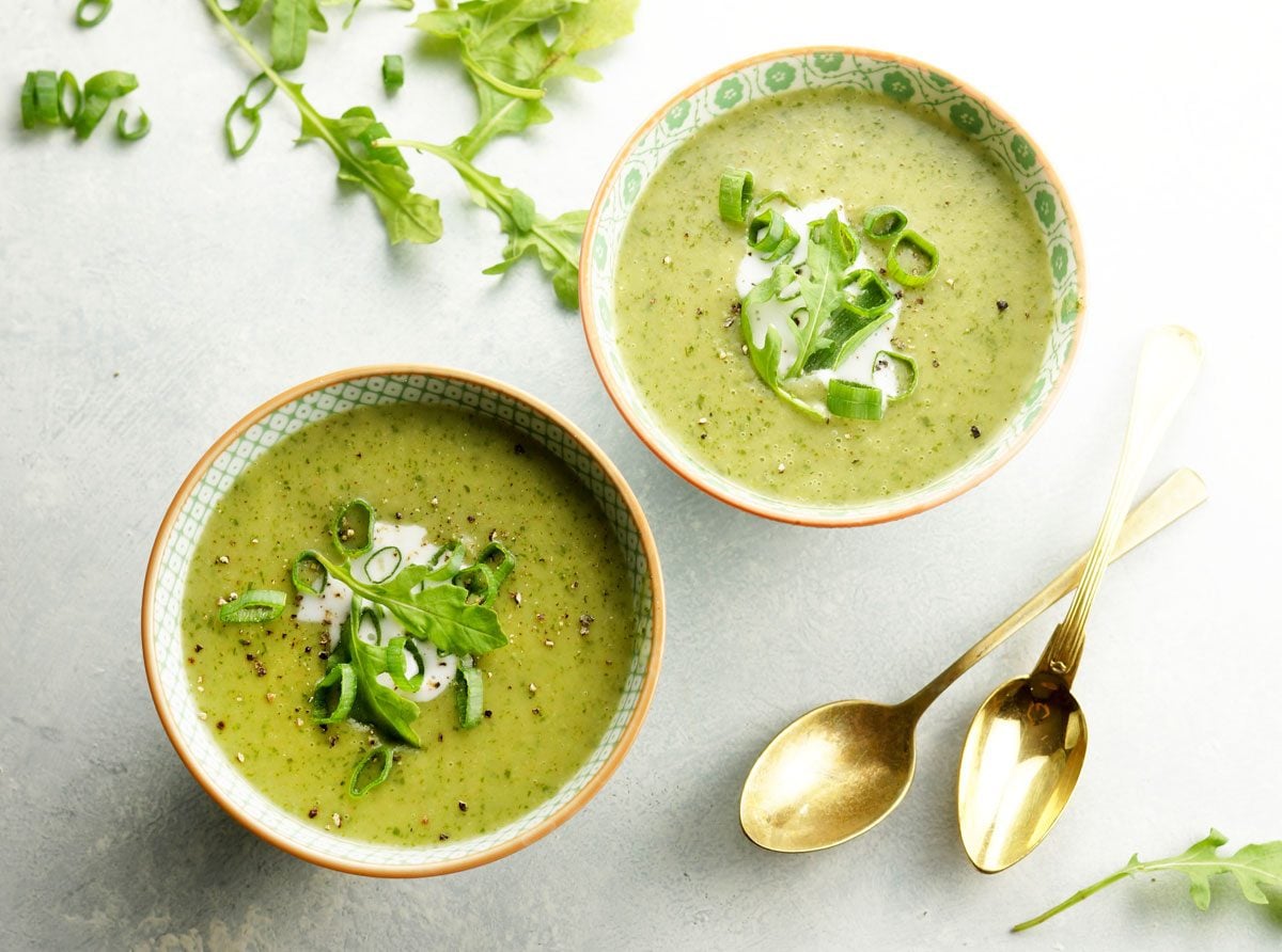 two bowls of arugula soup