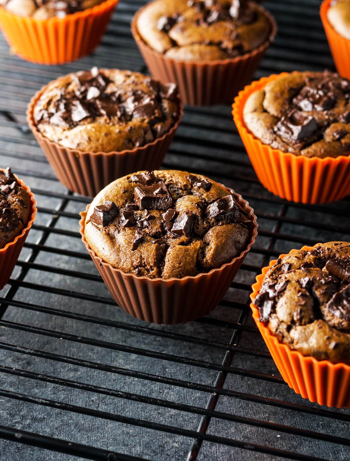 double chocolate pumpkin muffins on a cooling rack