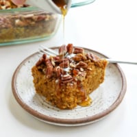 slice of pumpkin baked oatmeal with maple syrup