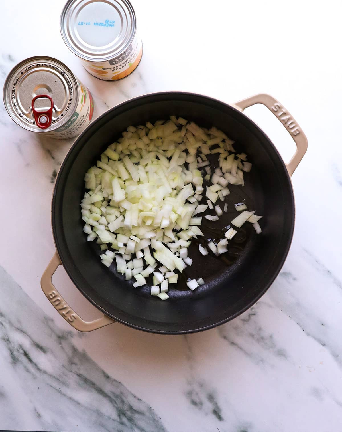 diced yellow onion added to a 4-quart pot with olive oil.
