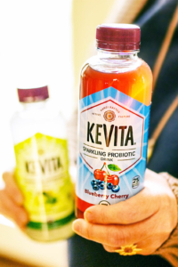 person holding kevita drinks