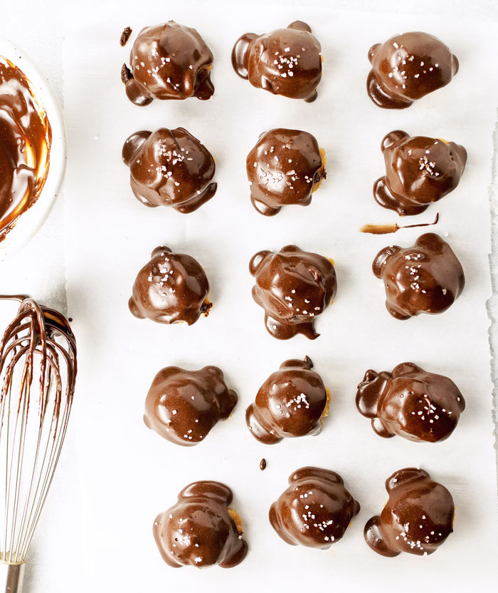 almond butter buckeyes with chocolate and salt on top