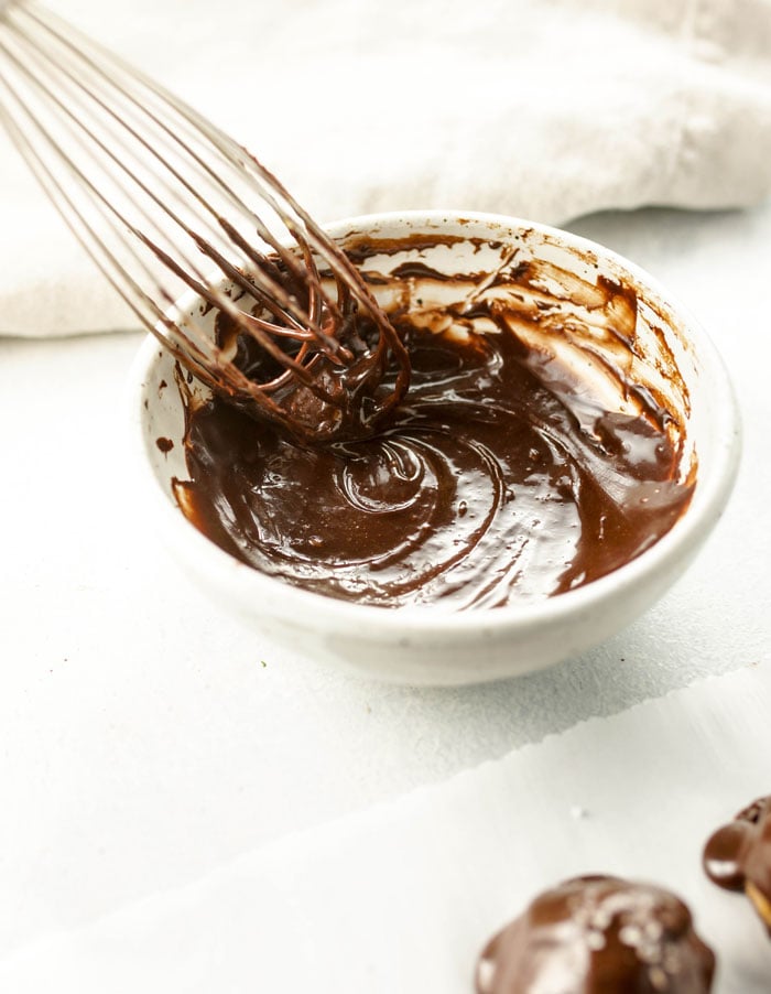 chocolate coating in a bowl with a wisk