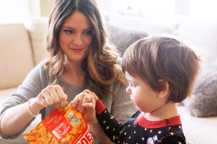 Megan with son opening a bag