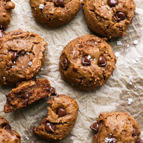 buckwheat cookies on parchment paper with salt on top.