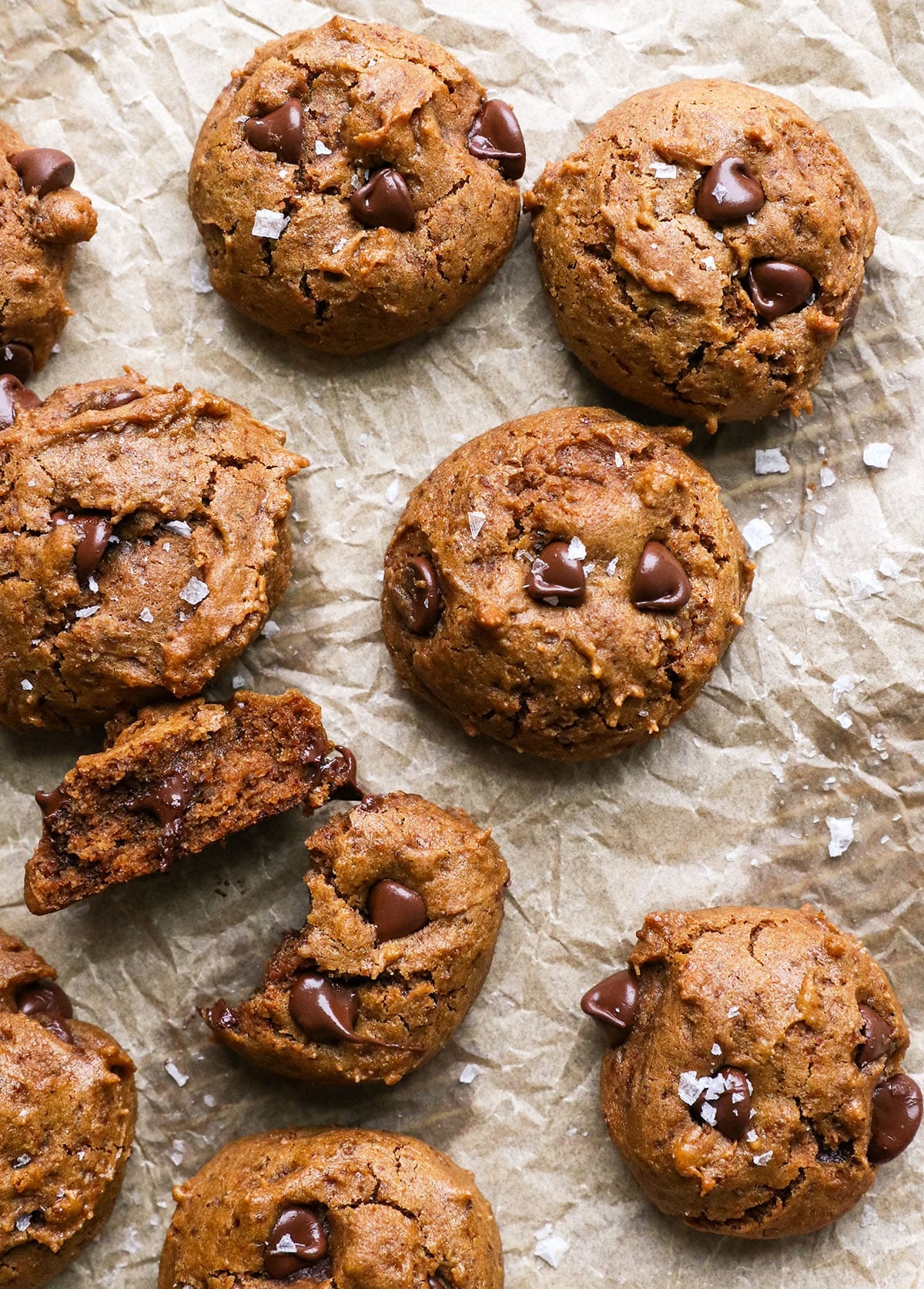 buckwheat cookies on parchment paper with salt on top.