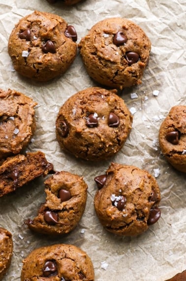 buckwheat chocolate chip cookies on brown parchment paper.