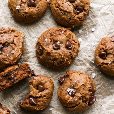 buckwheat chocolate chip cookies on brown parchment paper.