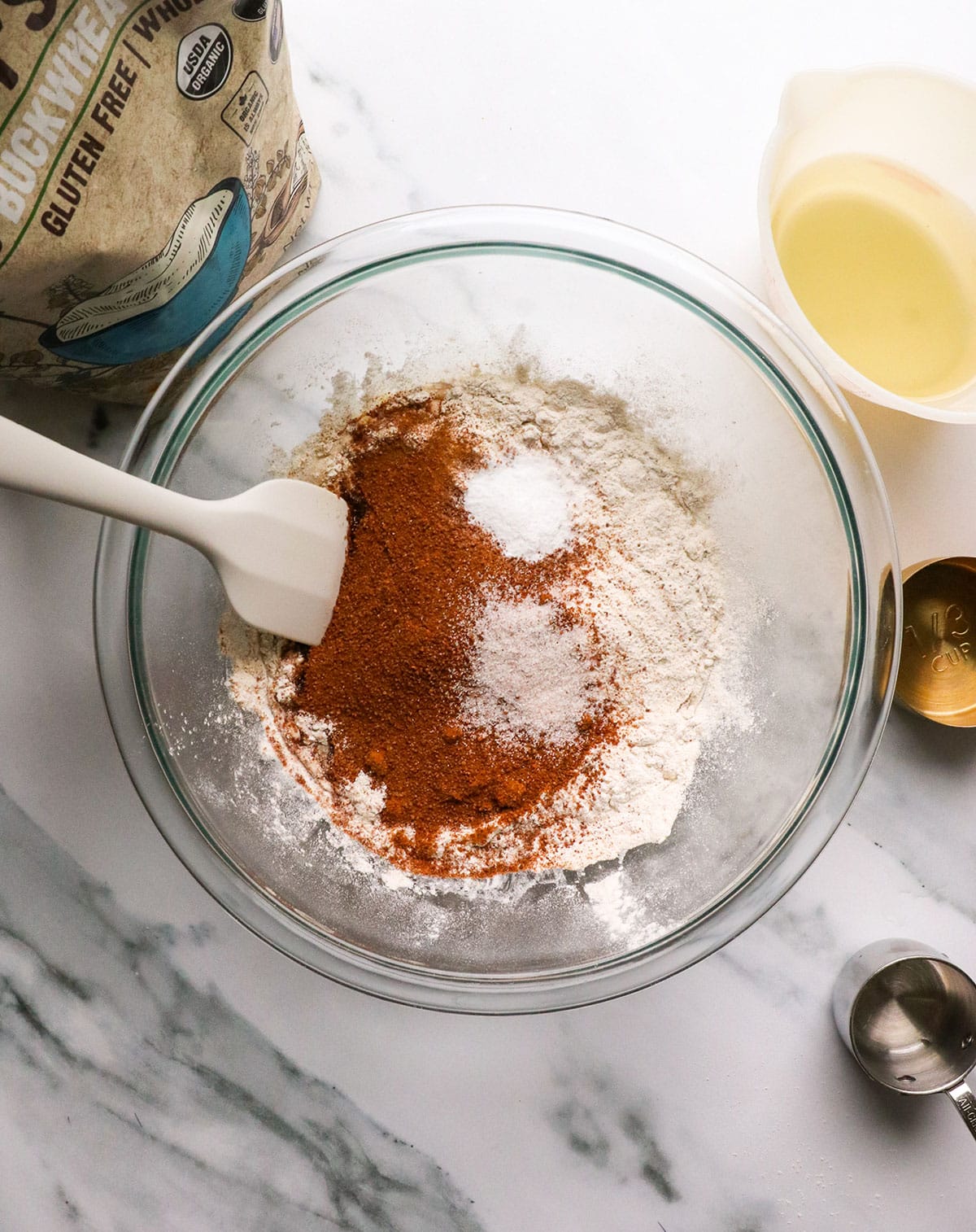 buckwheat flour, coconut sugar, baking soda and salt added to a bowl for mixing.