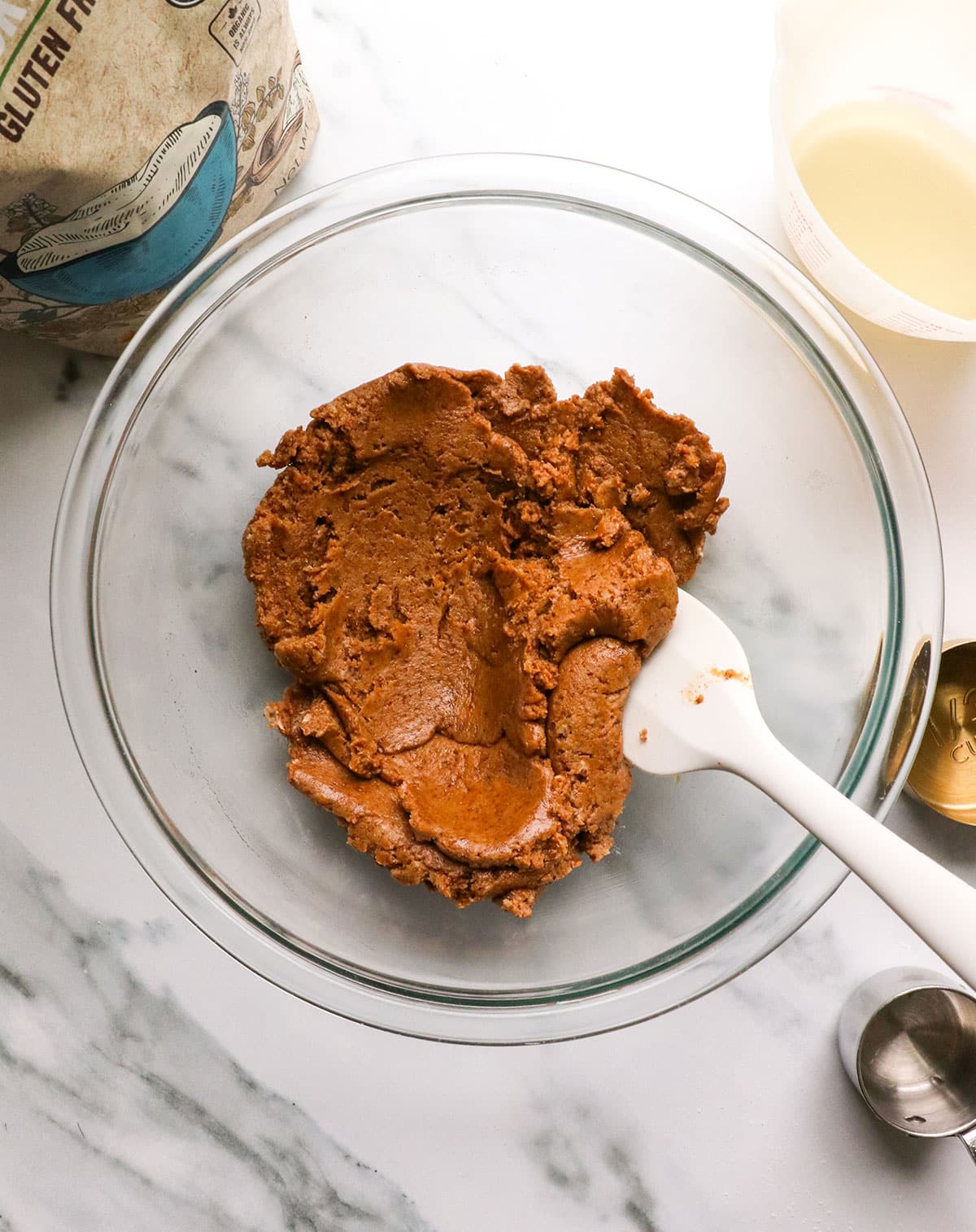 coconut oil stirred into buckwheat cookie dough so it's glossy looking.