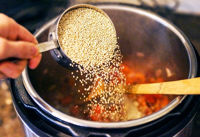 Quinoa poured into an instant pot
