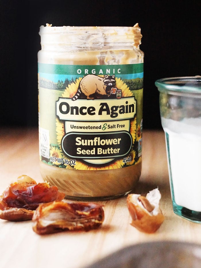 jar of sunflower seed butter with date split in half