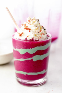 unicorn smoothie in glass with straw